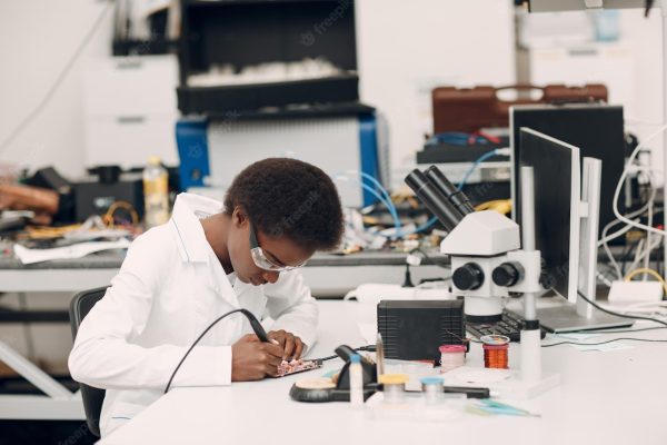 scientist-african-american-woman-working-laboratory-with-electronic-instruments_183314-7980